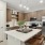a kitchen with a table and chairs at Bainbridge Nona North in Orlando, FL