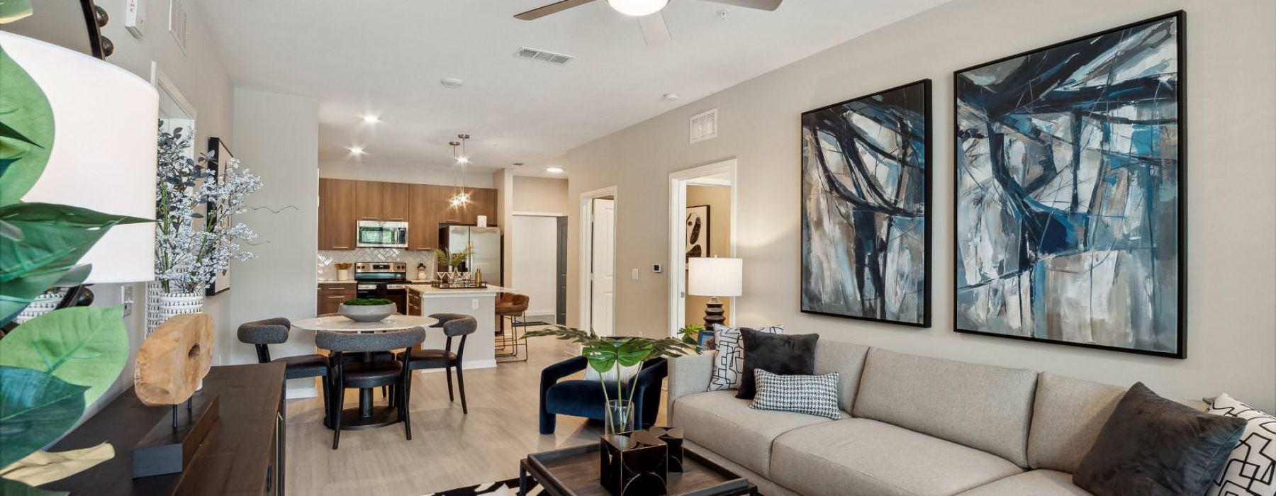 a living room with a ceiling fan at Bainbridge Nona North in Orlando, FL