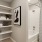 a bathroom with a shower and shelves at Bainbridge Nona North in Orlando, FL