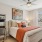 a bedroom with a bed and a chair at Bainbridge Nona North in Orlando, FL