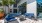 a group of blue chairs outside a building at Bainbridge Nona North in Orlando, FL