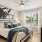 a bedroom with a bed and a fan at Bainbridge Nona North in Orlando, FL